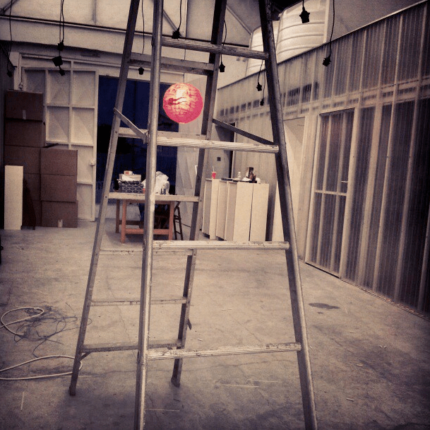 yasmine alkandari } by night time we managed to hand one lantern. at this point, the tapestries were still on the ground