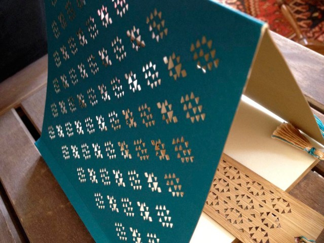 the die cut sadu pattern is delicate, so i'm a little terrified of drawing in this book