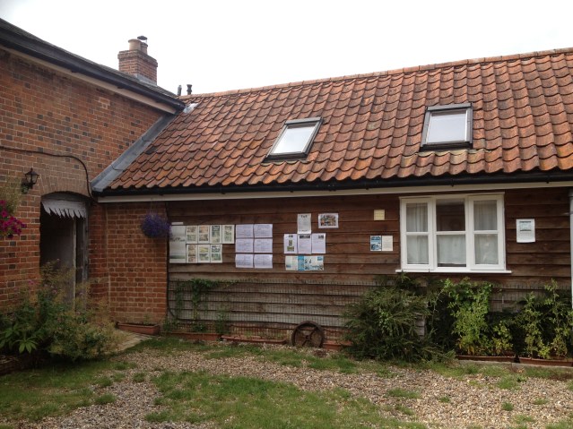 this is one of the other cottages. and there on the left is the walk-through, which leads to a communal garden and out into the fields