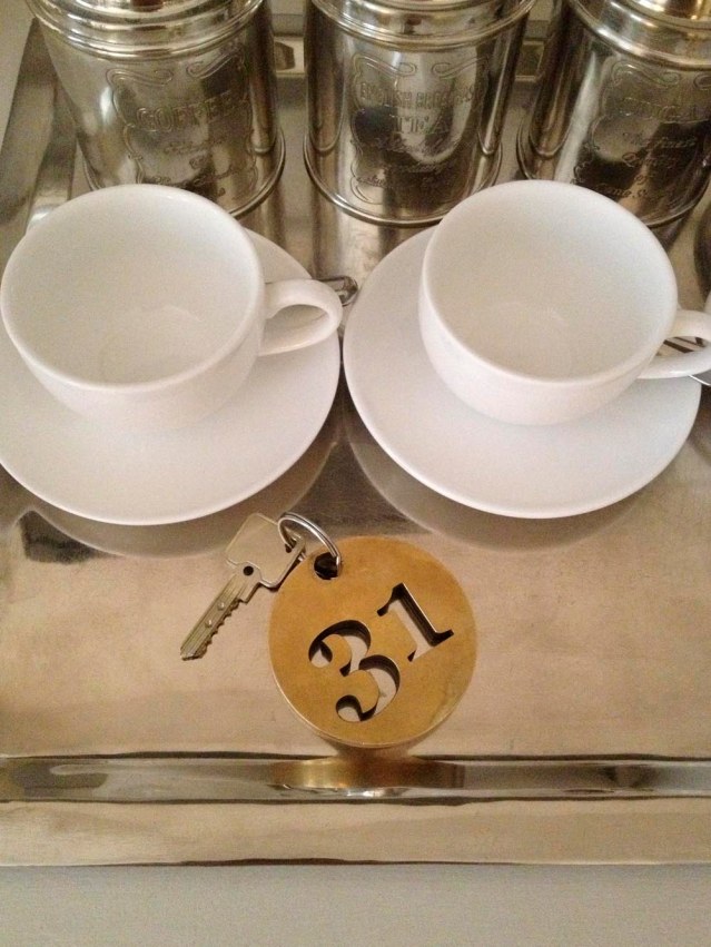 a real key, people! when is the last time you held one of those at a hotel? for practicality's sake though, guests are given a 'security' card, so you don't have to carry the key around town with you