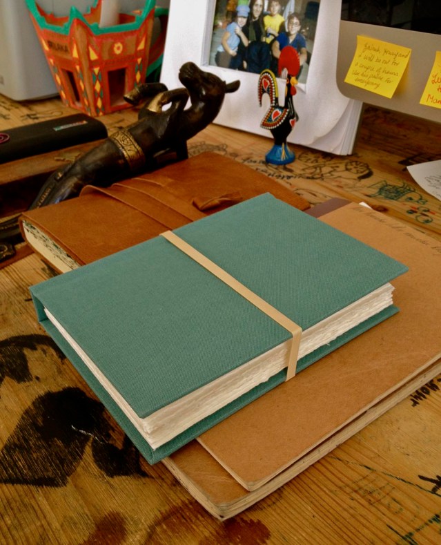 the rubber band has been put there by me. it's the only way i can tame the book