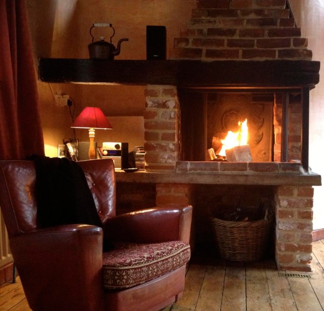 this may appear to you like a 'real' fire, but it's just the firestarters burning. soon after i patted myself on the back for my success, smoke started to puff back into the room. i didn't want to die of carbon monoxide poisoning so decided to put out the fire. i opened all the windows and waited outside for something. i think i was just waiting for mark to come back from a day trip to ipswich with his wife and kids. when he finally arrived, he built me a proper fire