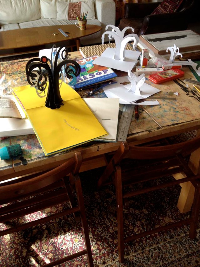 helping me with the pop-ups are these two books: one red dot by david a. carter and pop-up aesop by john harris and calef brown. i've also been learning from robert sabuda. not personally, unfortunately. but he has an amazingly helpful (and generous) website