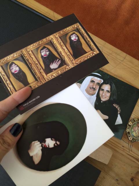 munira al qadiri's tragedy of self postcard and a photo of my father and me taken a decade ago