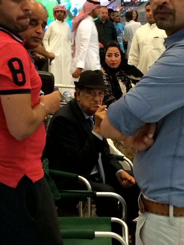 mayhem in kuwait airport. confetti, balloons being popped, bright lights...and this egyptian actor. they were filming a series. i don't think this guy's too happy he's being photographed by a crazy chick in black