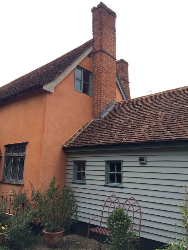 the side of the cottage. that window up there is the bedroom and the blue bit is the kitchen