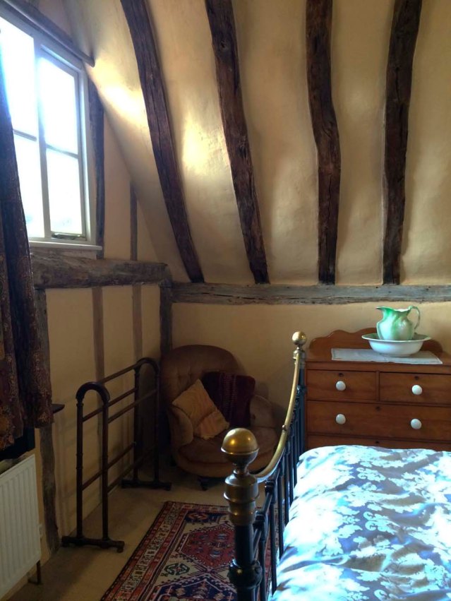 sunny in the daytime, i was a little scared to be here at night. and this is why i should never, ever visit one of these gorgeous cottages alone. oh! look at the chair in the corner. i fell in love with this chair, which looked like it had seen better days. but i'm like that; i find charm in battered old things