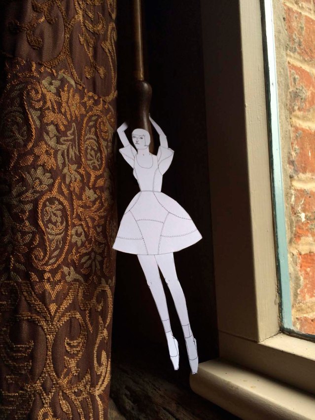 she hangs from drape cords