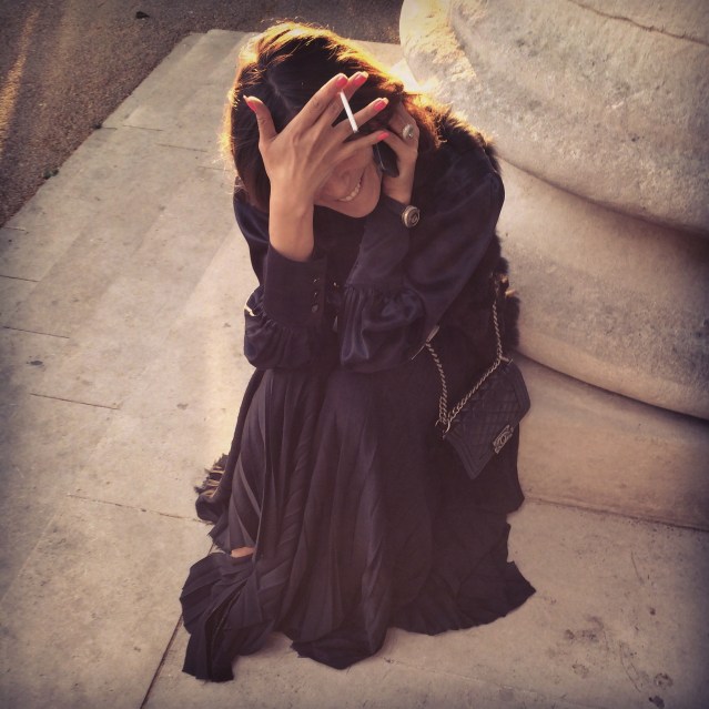 n outside. when my mom saw this photo she said she thought it was me until the nails gave it away. i would have thought the cigarette would have been the clue