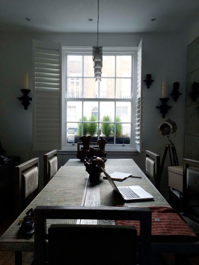 next morning, my temporary office space. behind the left shutter is a ceramic skull on a sconce. i nearly knocked it down that day. i did, however, manage to knock it down and break it to pieces my last day there