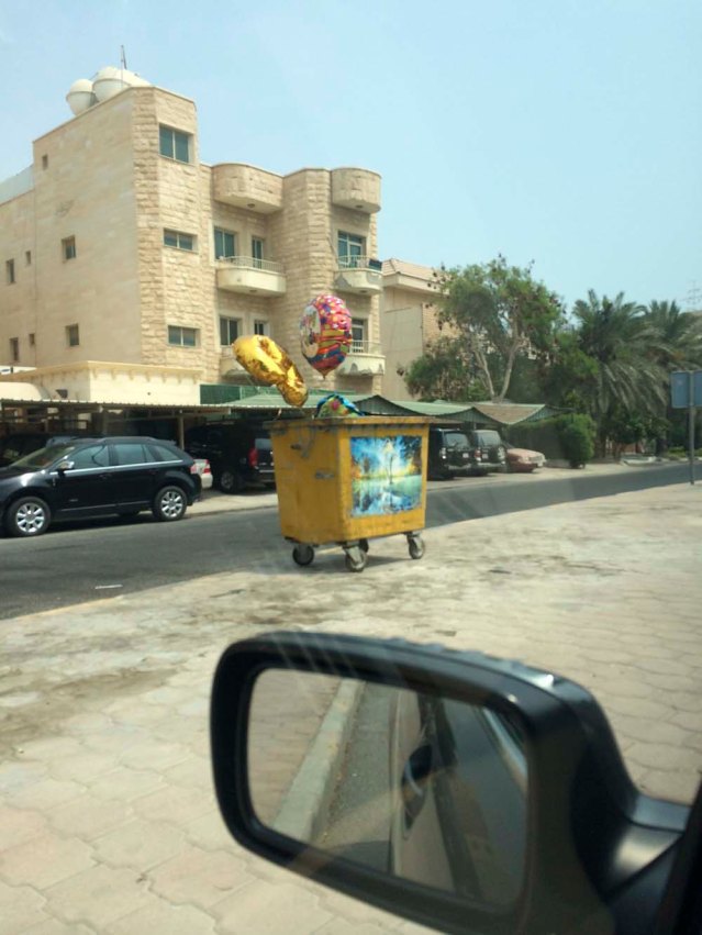 balloons in a garbage skip. i saw this this morning on my way to the supermarket. it didn't make sense to me but it was somewhat cute.