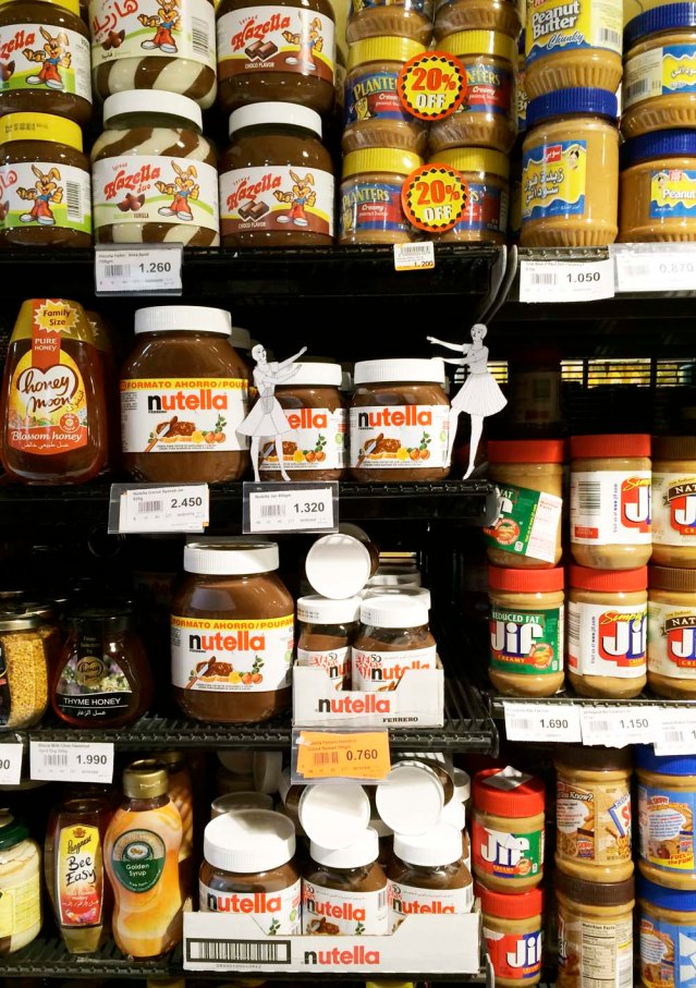 at the supermarket. ignoring my disapproving looks, they go for the nutella