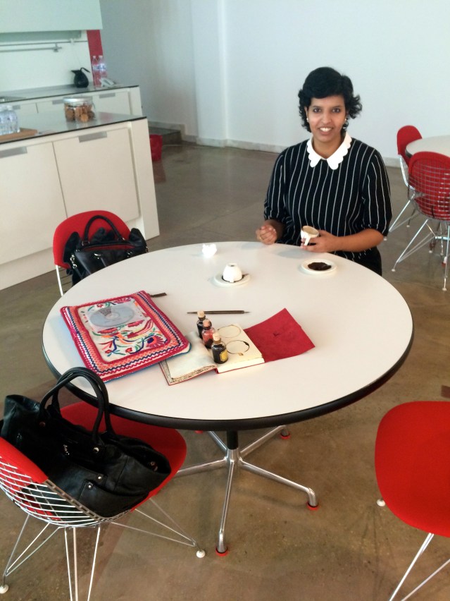 deema gets ready to read while she tells me stories from her life