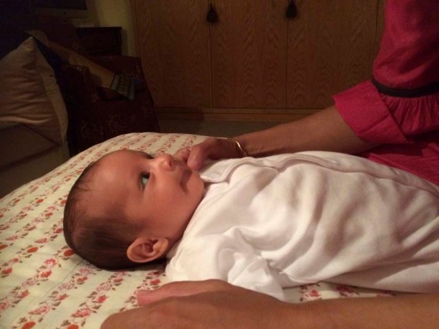 he's smiling at his aunty. i can't wait for a session of full-blown laughter with this little fella