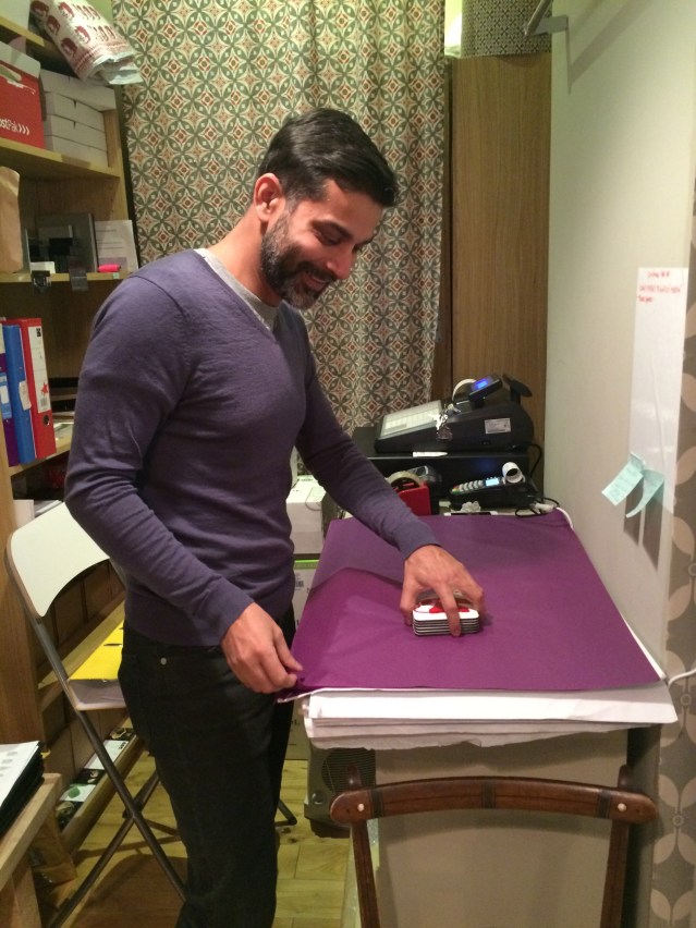 a bit of afternoon shopping resulted in me buying coasters for my sister and some lovely knit wrist-warmers for me. sarah bought a snood and a pair of wrist-warmers too. here piyush carefully wraps the coasters i bought for my sister
