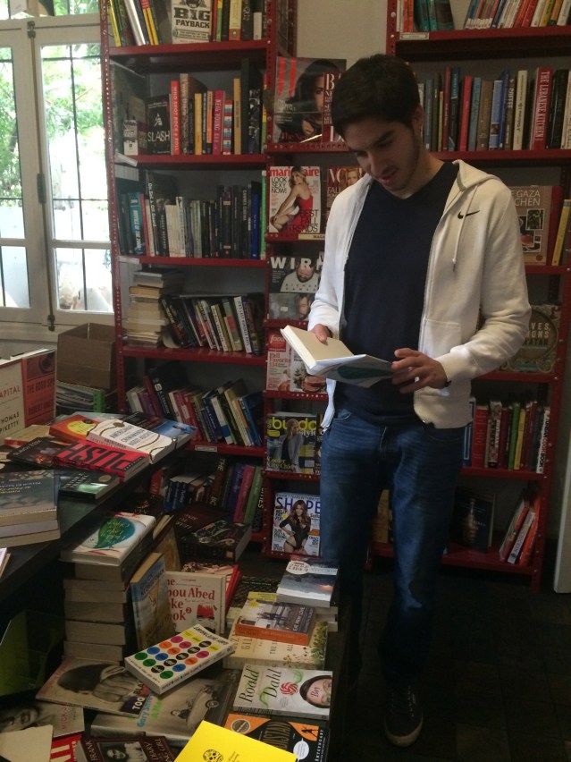 omar flips through his aunty mai's book