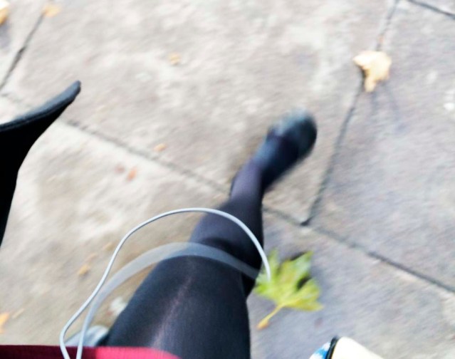 an accidental shot captures my interest. my favorite is the earphones. it looks like i'm wearing a lanyard with a leaf on its end