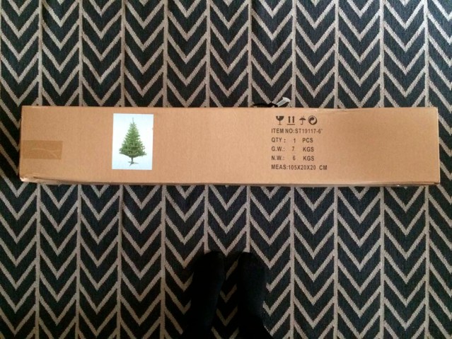 is this it? although i am so averse to fake plants, i preferred my first ever tree to be faked. one day when i become a pro christmas tree decorator, i will decorate my first real christmas tree. and preferably this tree will be outdoors rooted safely to the earth