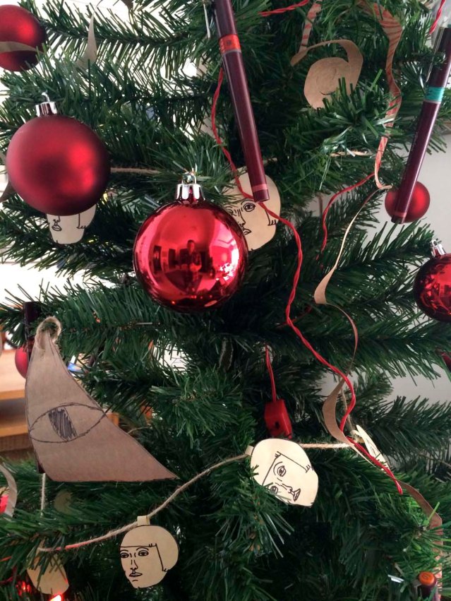 khaled's friend bader made this ornament. it's the symbol of the illuminati because it's his 'go to' thing to draw when anyone asks him to, which i had. nothing wrong with a little yuletide controversy