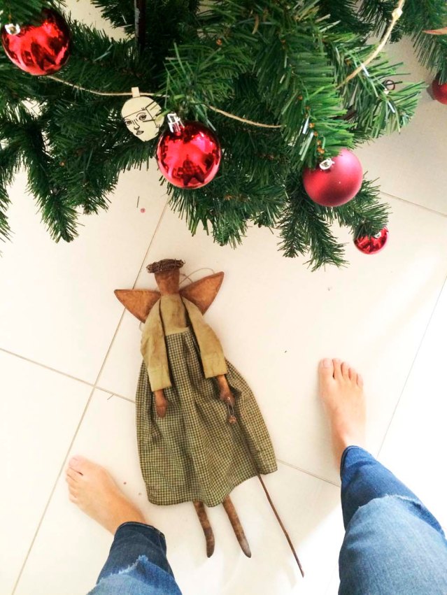 i bought this angel in germany seven years ago. i love everything about her. i added the rose stem to her left hand with a safety pin. the dried up stem is from a white rose once given to me by a very special person