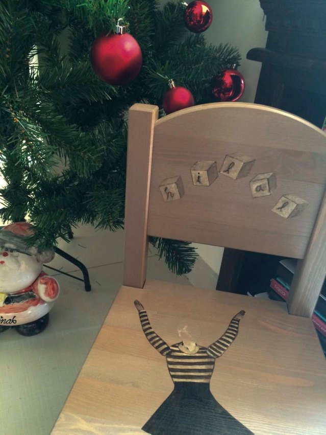 lali's chair. i made this chair for noor's little boy about a year ago. i need to affix a new head onto eve. we won't talk about how this little accident happened. on another note, the chair has snuck its way into our christmas corner