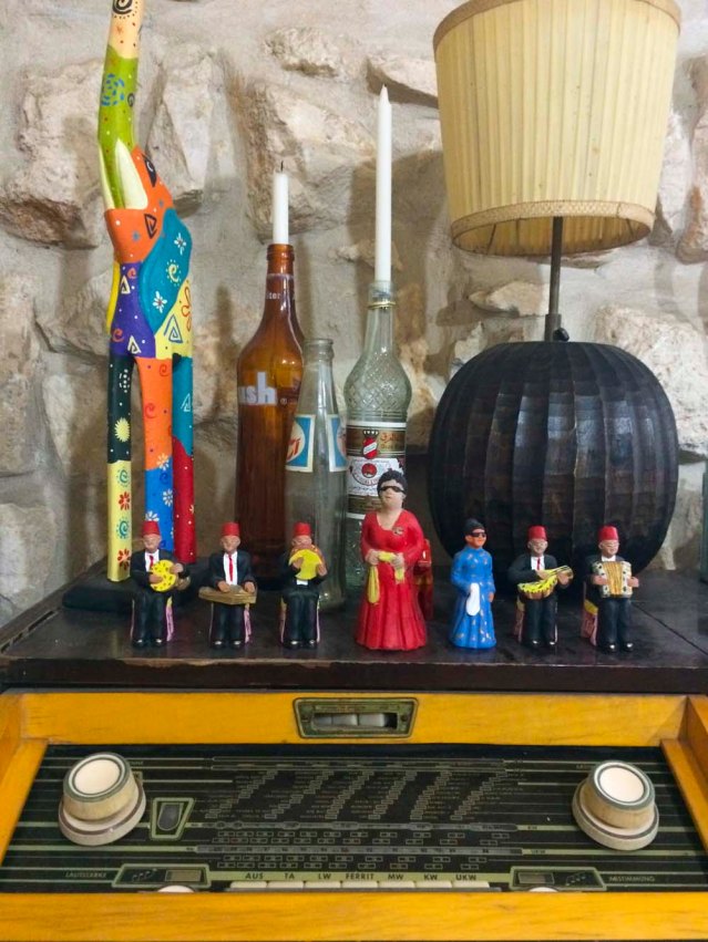 a small um kulthum, a tiny um kulthum, and their band