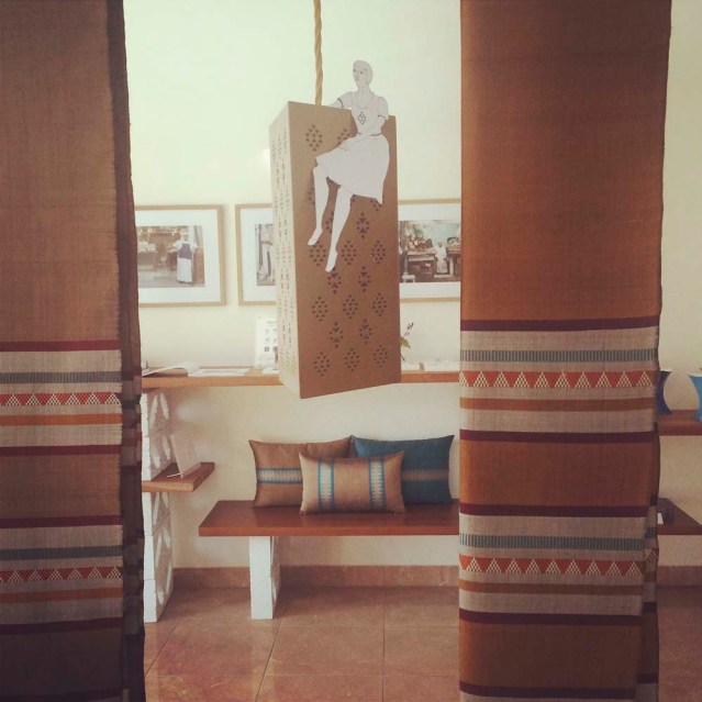 eve hangs from a mashrabiya lamp