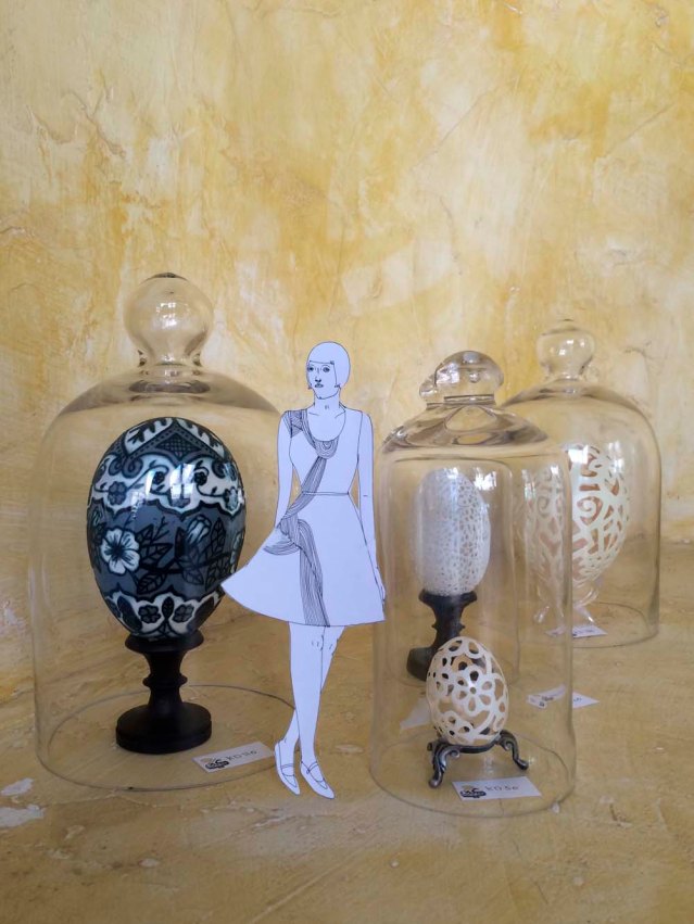 eve takes a stroll among reem al-nouri's carved eggs