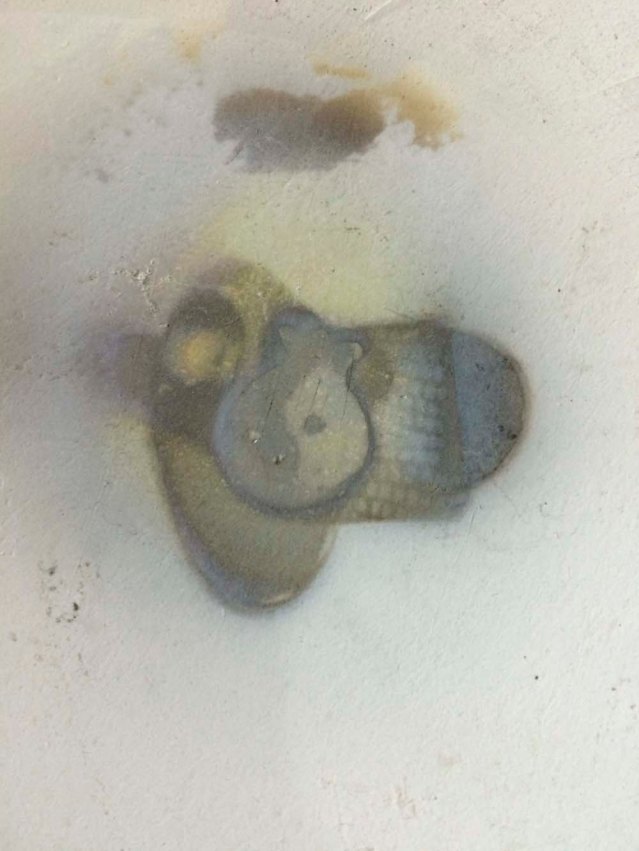 i love the burning marks left on the slab after each heating process. here, lina's pomegranate piece has left behind a yin and yang