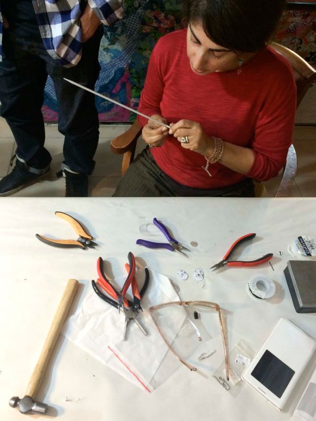 i made the components but lubna generously put everything together. because i made the holes in my pieces so tiny, it was a challenge finding a wire thin enough for the jump rings, so here Lubna is creating custom ones for me. this is what i call love and passion for one's vocation