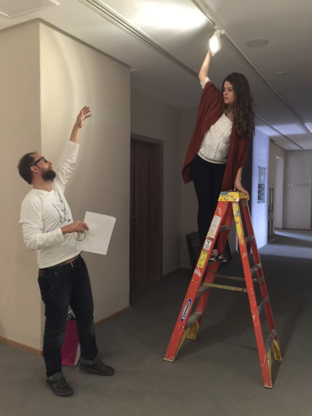fixing the lights. don't fall, farah! photo by farida sultan