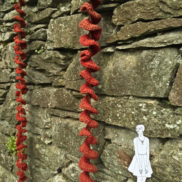 she finds hanging knit sculptures by dianne standen. she wishes she could knit, and decorate nature with her creations