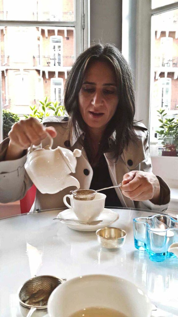 i pour tea. i feel like i must explain why i have my rain coat on at all times. it was so hot and i hadn't packed anything other than comfy turtlenecks. so on this day i wore my pj top and this jacket over it all day