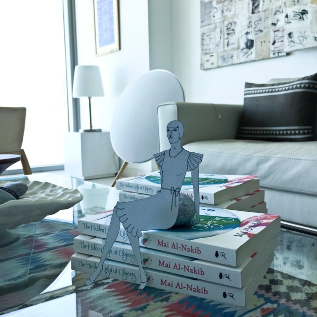 i brought along eve, who sat gracefully on the cushiony editions of mai's book