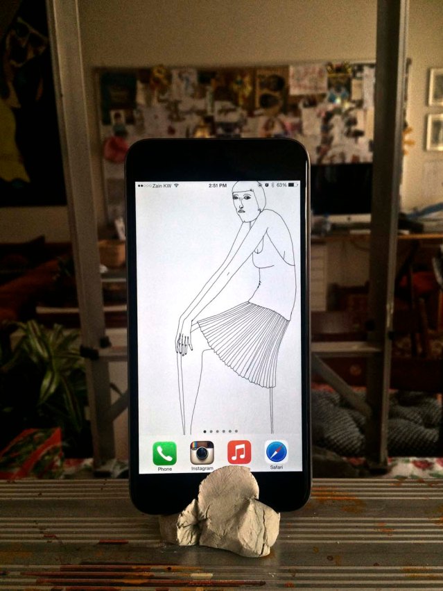 I once joked to a friend that the only time I used my regular camera was to take a picture of my phone. Well, I took this photo with my old iphone. the stand is an impromptu one i made from clay. it's so annoying that the new iphones have rounded edges. ugh