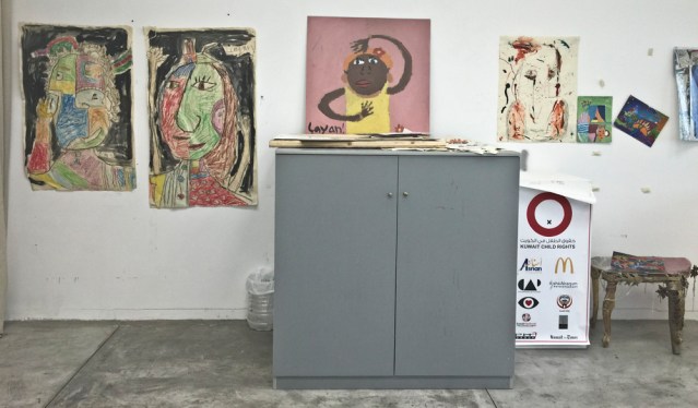 i love children's drawings and paintings. no one does it like they do. these are right outside his workspace