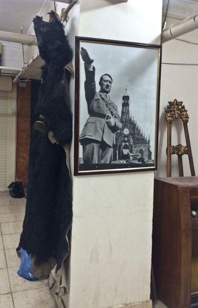 in the basement of 'wig mall' z and i were alone in this indoor antique market. dalal actually told us about it when i inquired about the notebook she gave me. so it wasn't a total surprise. it was creepy, as you can imagine. and i don't know what's more controversial: a hanging bear rug (badly stuffed at that) or a framed poster of hitler