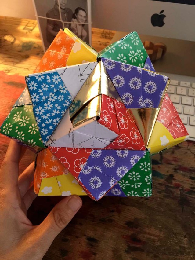 they are so pretty. i'm going to order some more origami paper (i was one sheet short here so used a page from the instruction manual)