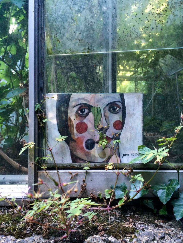 the third greenhouse is the emptiest and the most overgrown. this one resists leaving. she hides in between the panels but i finally manage to wrest her from the panes