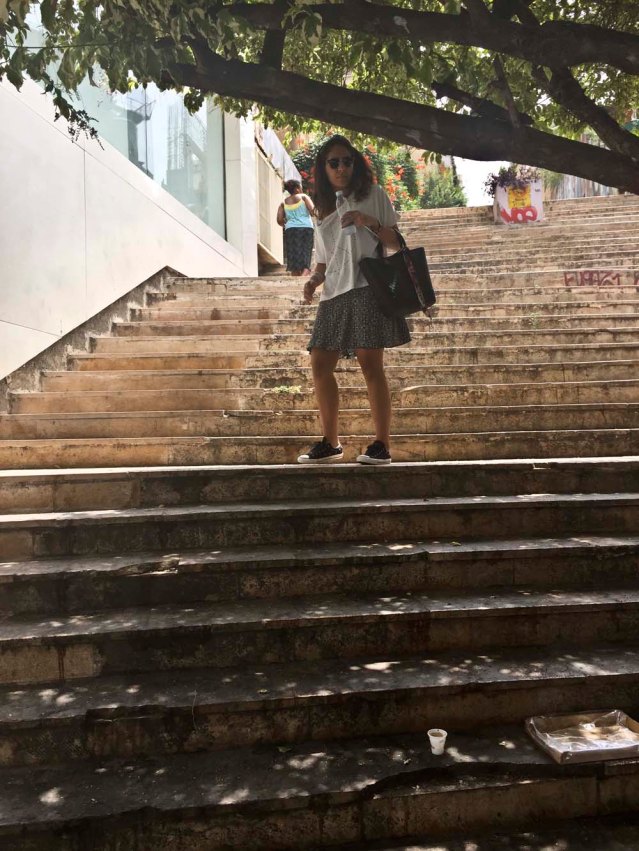 yasmine and the steps. i regret so much not bringing my traveling tap, even though it would have been a pain lugging it around in the heat