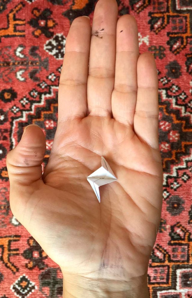 saturday night i wrote mr. lavavej a long email wondering what i had done wrong, if he had any advice for me, and attached a photo of my loser polyhedron. he responded saying that my pieces were too large and that they weren't all folded to precision (which is true, i must admit). so i made them much smaller, which makes them far less precise. so i'm thinking of using very light paper next time to facilitate the folding