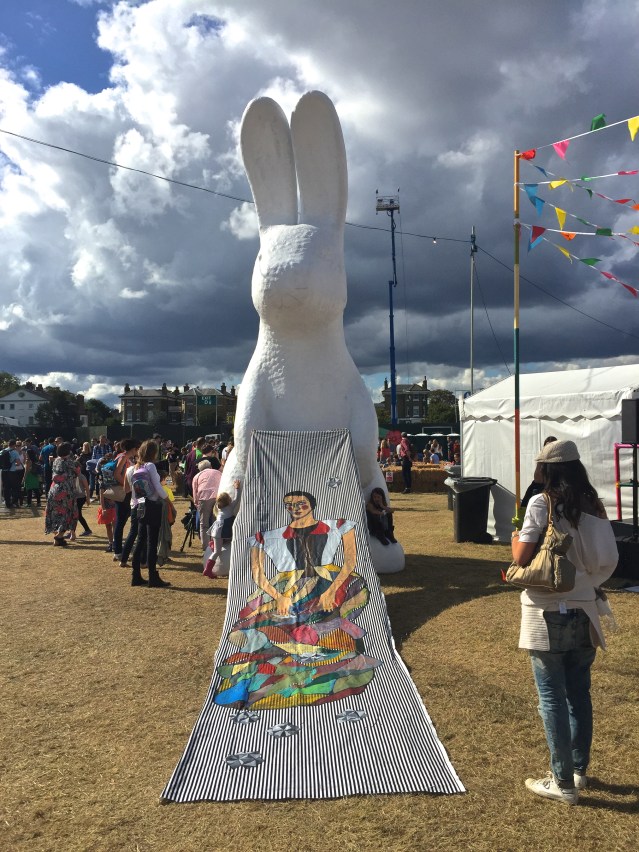 the white bunny helps me with the tapestry