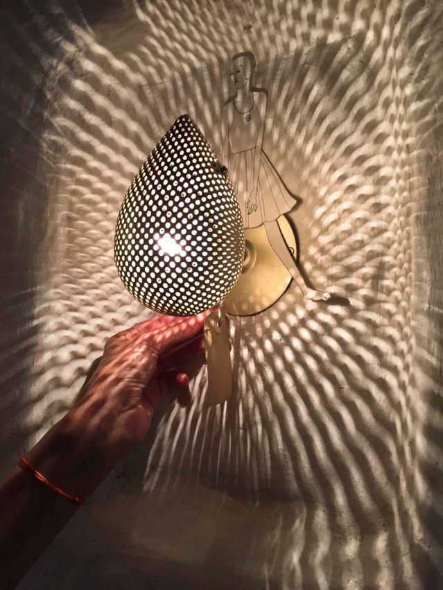 eve astride a gorgeous wall sconce