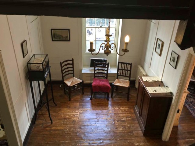 on one of the landings is a brick from the great wall of china and these three chairs